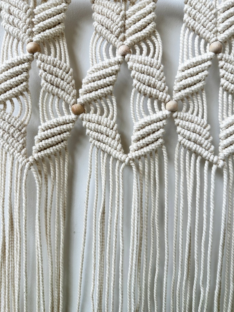 Handmade Macrame Plant Shelf: Boho Wall Hanging with Wooden Dowel